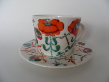 Korento kuppi ja aluslautanen oranssi Iittala 